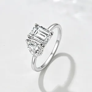 S925 sterling silver ring with water drop and rectangular zircon stones on grey background