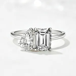 Macro detail of S925 silver ring featuring pear and emerald cut cubic zirconia stones