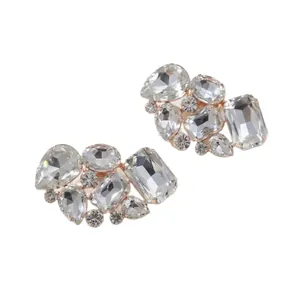 Elegant rose gold shoe clips with clear glass rhinestones in geometric crystal shapes