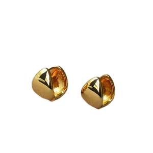 Minimalist gold-plated teardrop hoop earrings with high-polish finish on white background