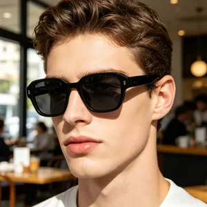 Close-up of black square frame polarized sunglasses with metal rivets on male model