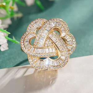 Detailed close-up of a floral ring with gold petals and inlaid sparkling cubic zirconia