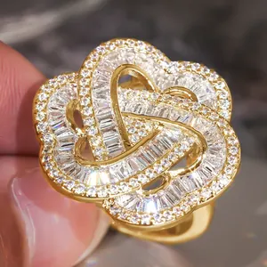 Detailed macro view of an intricate gold flower ring set with sparkling zircon stones