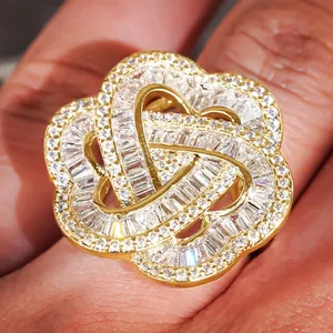 Detailed close-up of a luxury gold-plated flower ring with sparkling baguette-cut zircons