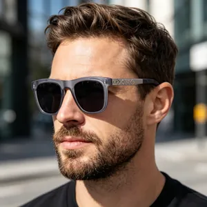 Detail of square polarized sunglasses featuring intricate silver engraved metal temples