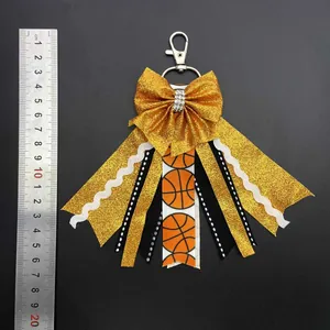 Detailed view of handmade sports bow keychain with glitter and basketball patterns, 18.5cm long