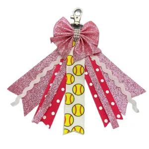 Handmade softball bow keychain featuring pink glitter ribbons and silver lobster clasp