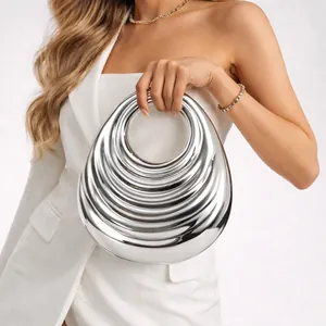 Fashionable silver metallic acrylic evening handbag with unique architectural tiered design