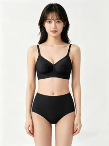 Detail of black seamless wire-free bra set with thin straps and smooth jelly-like support