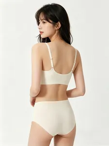Detail view of seamless beige lingerie set showing the back fit and smooth fabric texture
