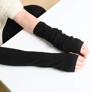 Long black knitted fingerless gloves for women, stylish warm arm warmers for autumn and winter