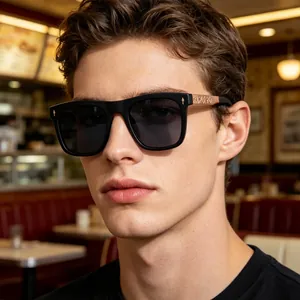 Fashionable square black sunglasses for men with rose gold metal accents and dark grey lenses