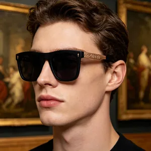 Detail of square black sunglasses featuring antique bronze embossed metal temples