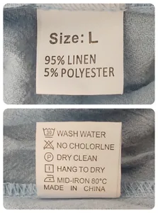 Detail of the internal garment care label showing 95% linen material on blue fabric