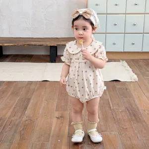 Baby polka dot romper with Peter Pan collar and matching bow headband for summer wear