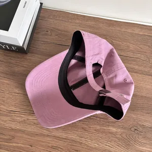 Detail view of cotton baseball cap interior featuring sweatband and adjustable metal buckle