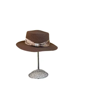 Brown flat top straw hat with floral ribbon and pearl accents for summer sun protection
