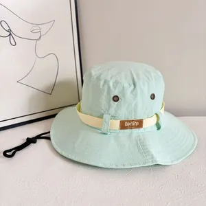 Mint green wide brim sun hat with breathable vents and adjustable drawstring for outdoor travel