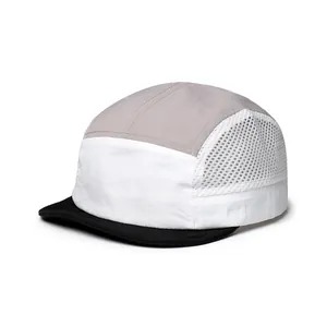Detail of 5-panel camping cap showing breathable mesh panels and precision stitching