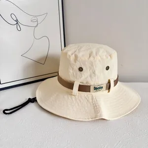 Detail view of quick-dry nylon sun hat fabric texture and adjustable windproof strap
