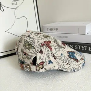 Detail of vintage floral butterfly jacquard hat with adjustable bronze buckle
