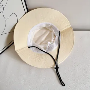 Detail of wide brim sun hat with breathable mesh lining and adjustable chin strap