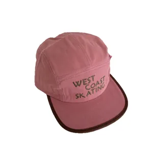 Short brim 5-panel camping hat in dusty rose with West Coast Skating embroidery