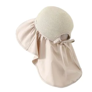 Cappello da sole beige a tesa larga con patchwork in paglia, protezione collo e fiocco