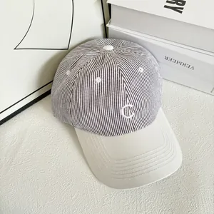 Striped seersucker baseball cap with white C embroidery and stylish cream visor