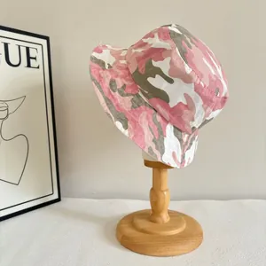 Close-up of pink camouflage bucket hat made from washed cotton canvas material