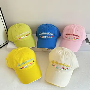 Detail showing five colorful cotton baseball caps with cute mushroom embroidery icons