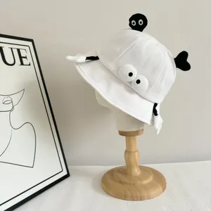 Cute white cotton bucket hat with cartoon eyes and 3D plush soot sprite character