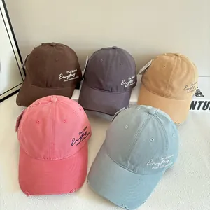 Close-up of distressed quick-dry baseball caps with side embroidery in five soft colors