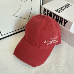 Detailed shot of breathable baseball cap with side embroidery and distressed finish