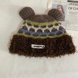 Detailed view of the cute bear ears and multi-color jacquard pattern on the winter hat