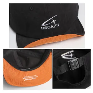 Dettaglio di un cappello da baseball nero e arancione con logo OSCAPS ricamato e cinturino