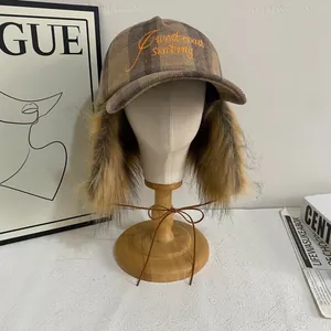 Plaid winter baseball cap with plush earflaps and West Coast Skating embroidery