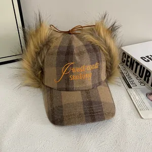Checkered trapper baseball cap with brown faux fur earflaps and West Coast embroidery