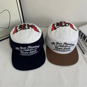 Flat top cadet caps with letter embroidery and contrast color design for a street style look