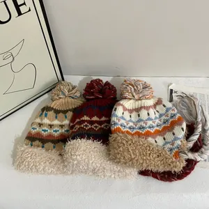Chapeau de trappeur en tricot Fair Isle avec doublure polaire et pompons pour l'hiver