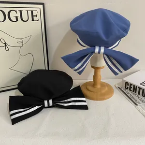 Sweet sailor beret with large striped bow detail in blue and black twill fabric