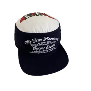 Flat top color-block baseball cap with heavy metal style embroidery on white background