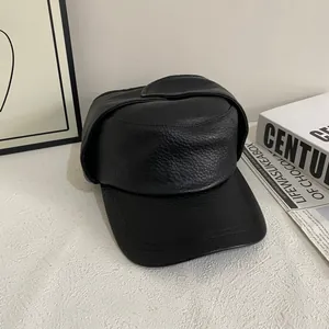 Vintage black faux leather aviator hat with earflaps and textured litchi grain finish