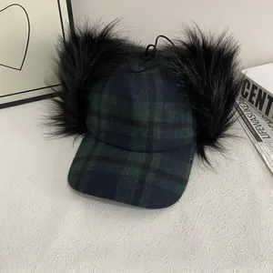 Green plaid baseball cap with black faux fur earflaps and adjustable top drawstring