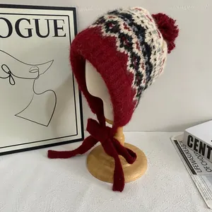 Winter Fair Isle knit earflap hat with fleece lining and pom-pom in retro burgundy