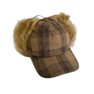 Brown plaid baseball hat with faux fur earflaps and vintage winter design