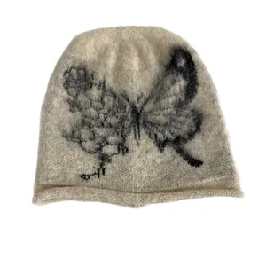 Beige knit beanie with butterfly embroidery and vintage rolled edge for women