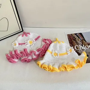 Handmade crochet knit flower hats for women featuring ruffled brims in white pink and yellow