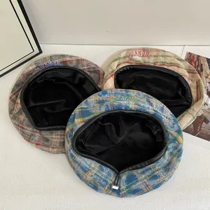 Retro plaid beret hats for men and women in blue, grey and beige with embroidered logo