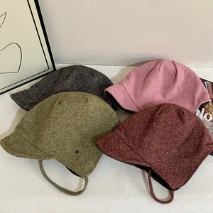 Japanese style reversible earflap hats with herringbone pattern and colorful speckles